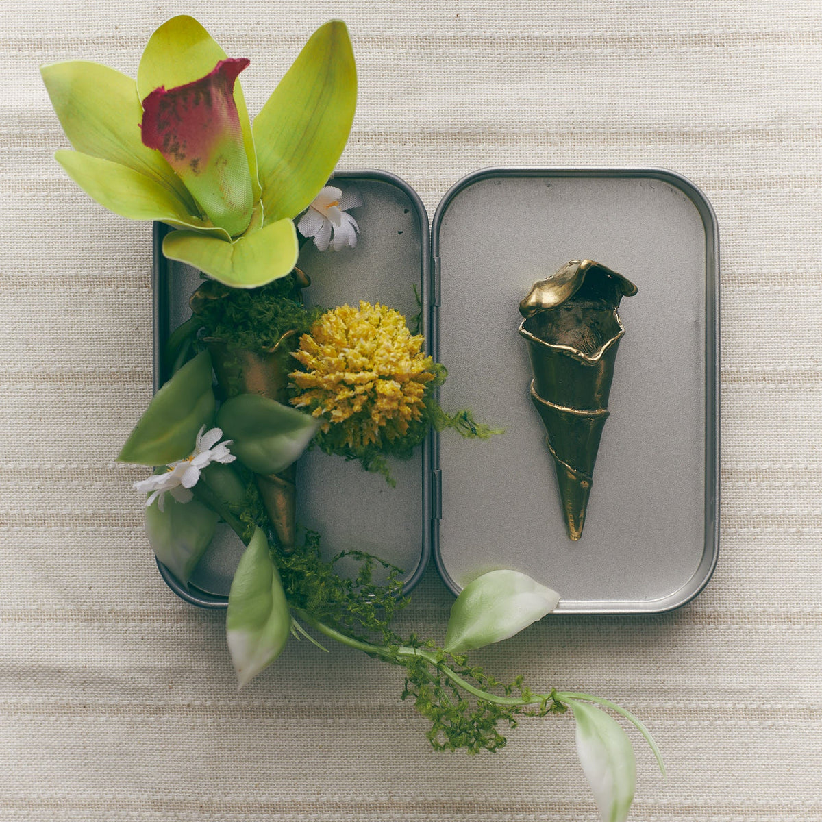 Project Piccolo orchid zipper pull on a sculptural heart dish